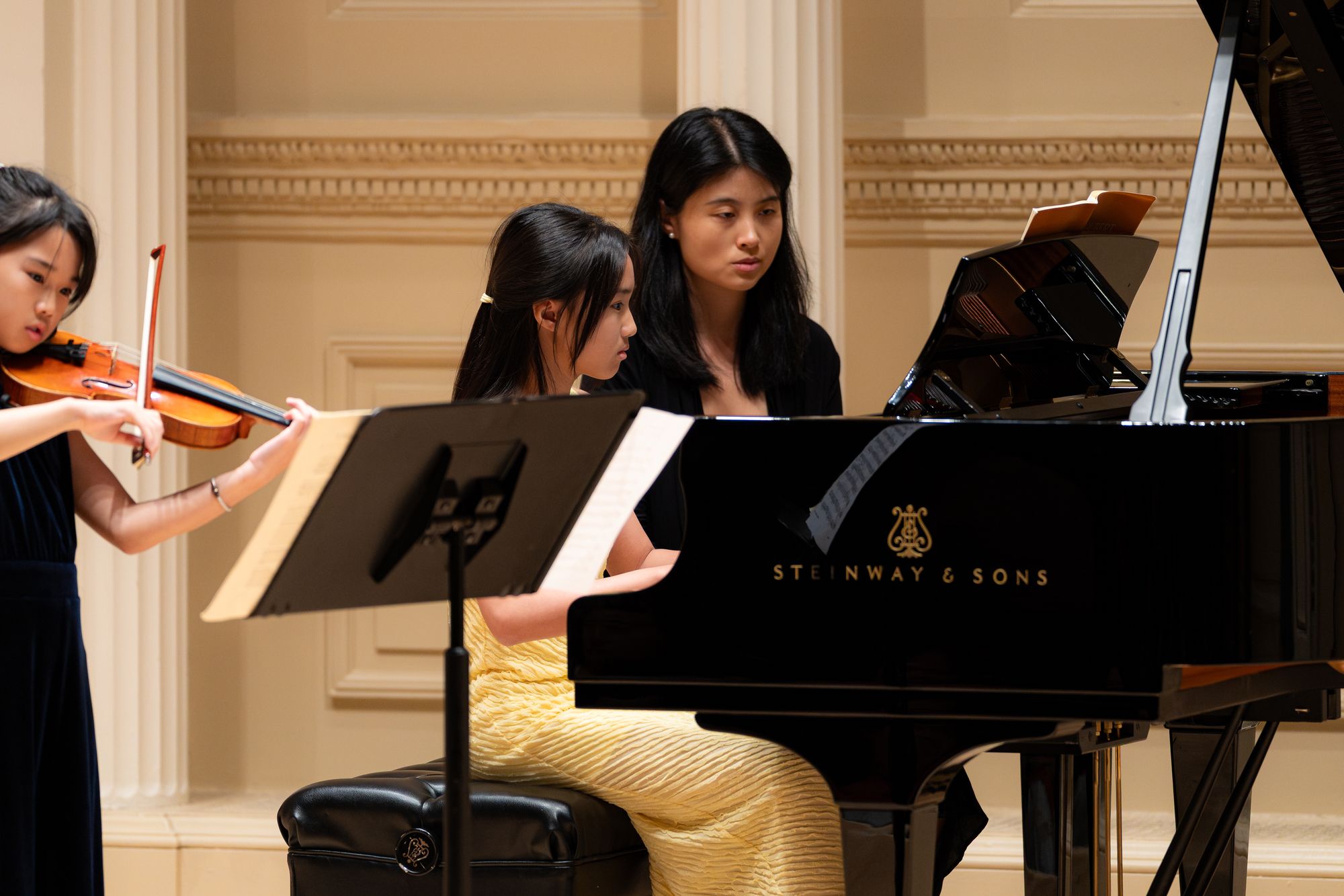 A violinist and pianist perform a duo