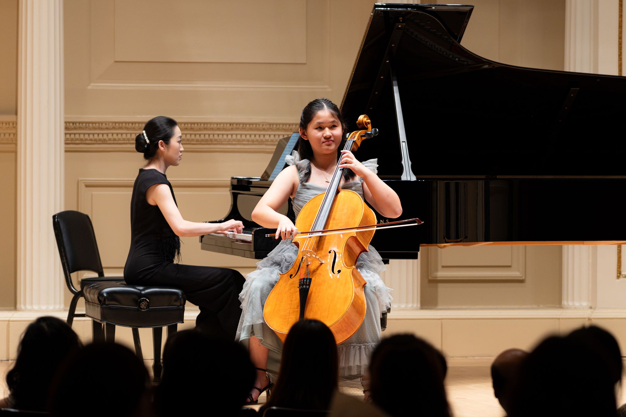 A cellist performs with piano
