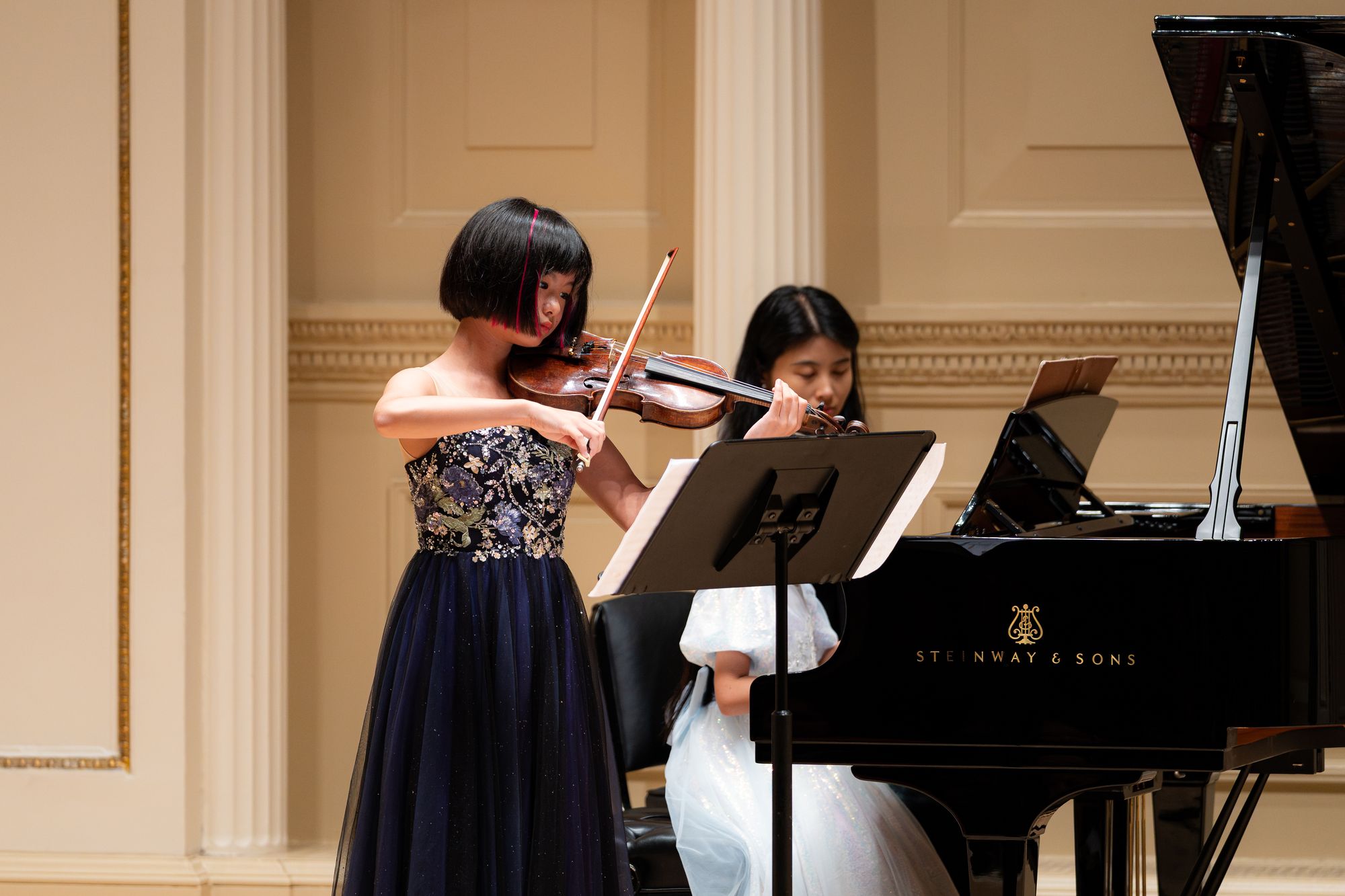Violinist performing with piano