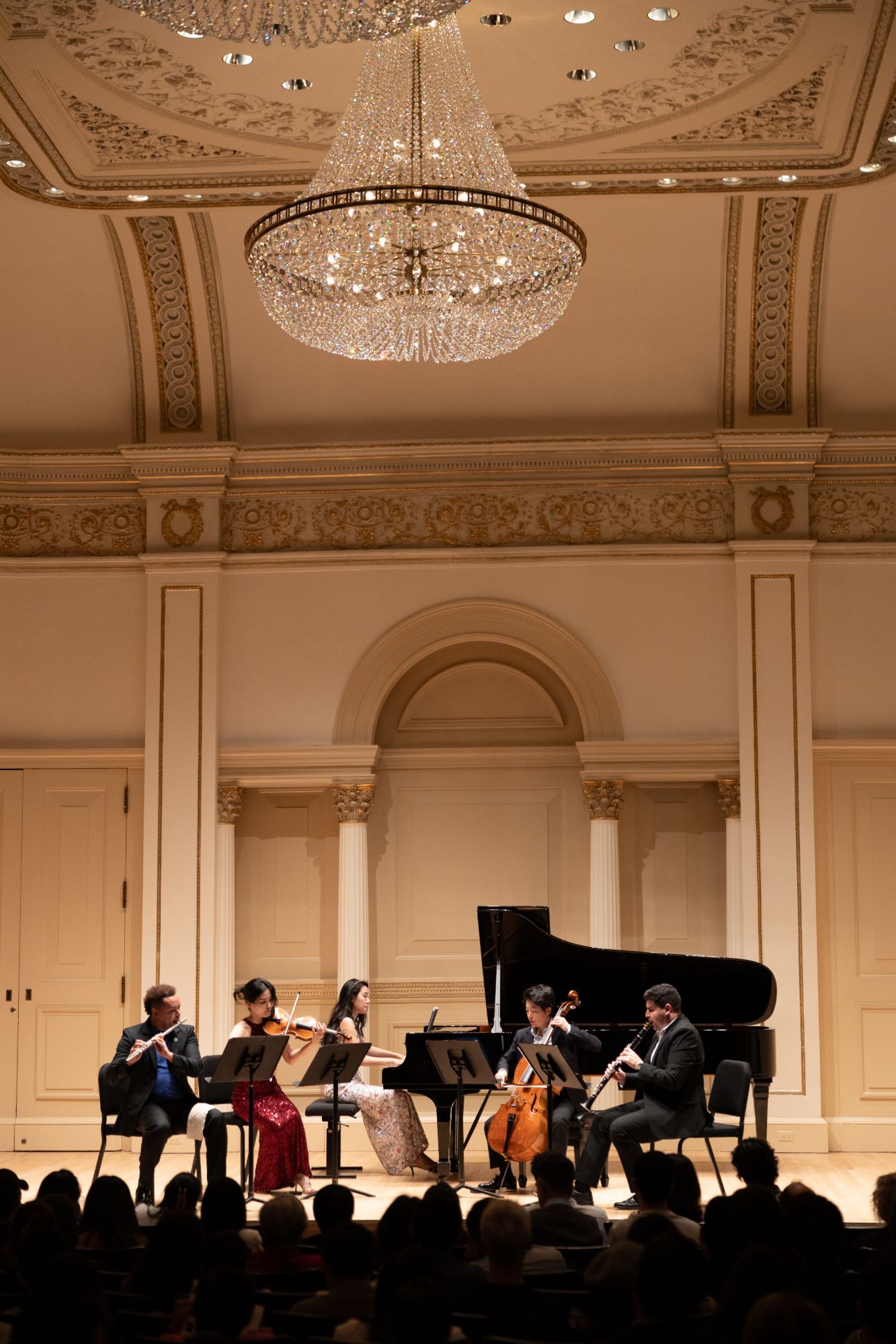 The quintet performs beneath the chandelier of Weill Recital Hall