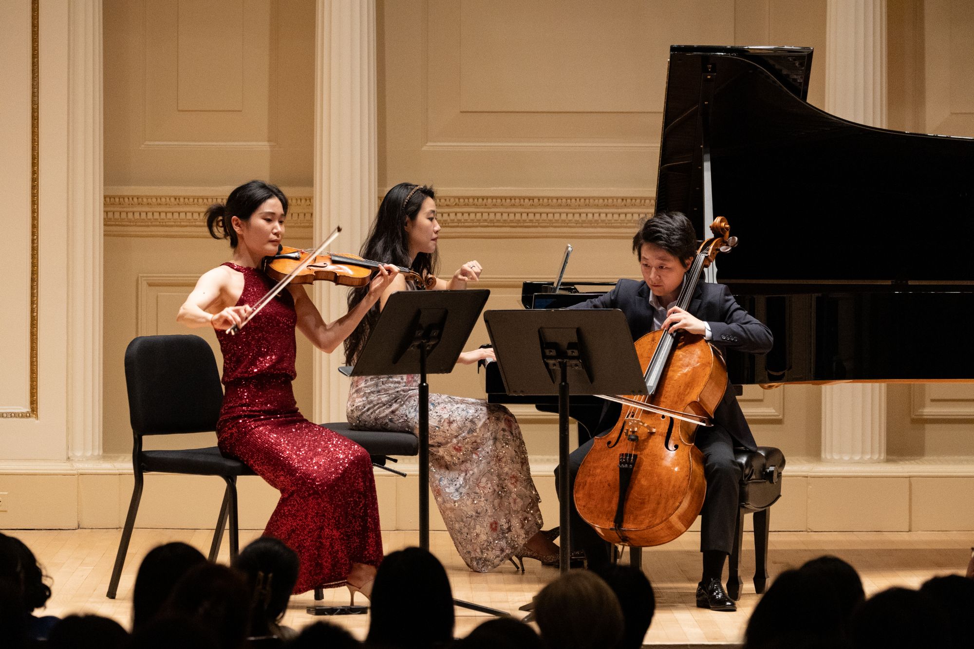 The piano trio performs on the stage of Weill Recital Hall