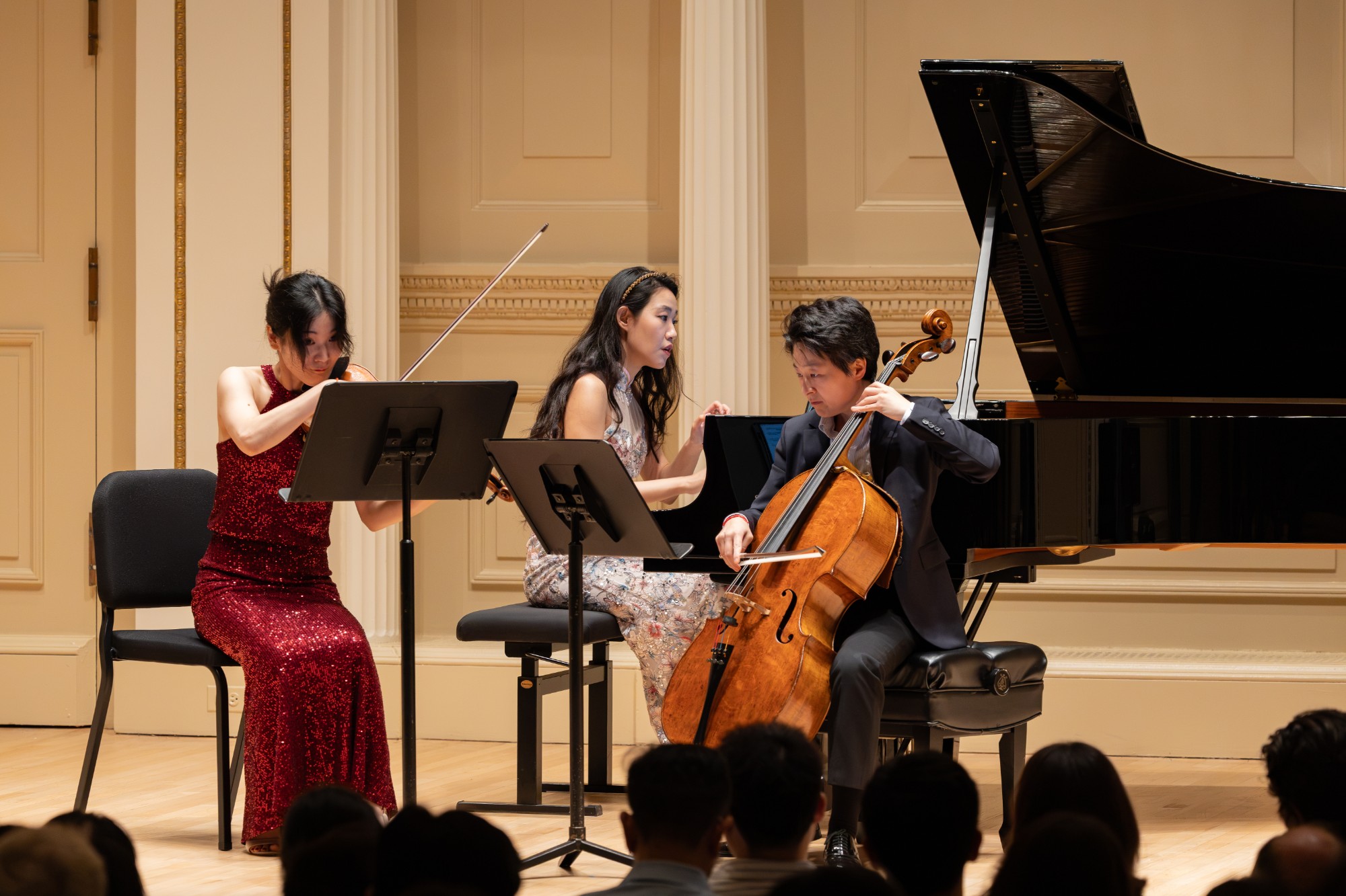 The pianist and cellist trade a cue mid-phrase
