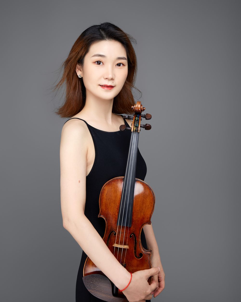 Qianwen Shen, founder of Overture Music Intensive, with her violin