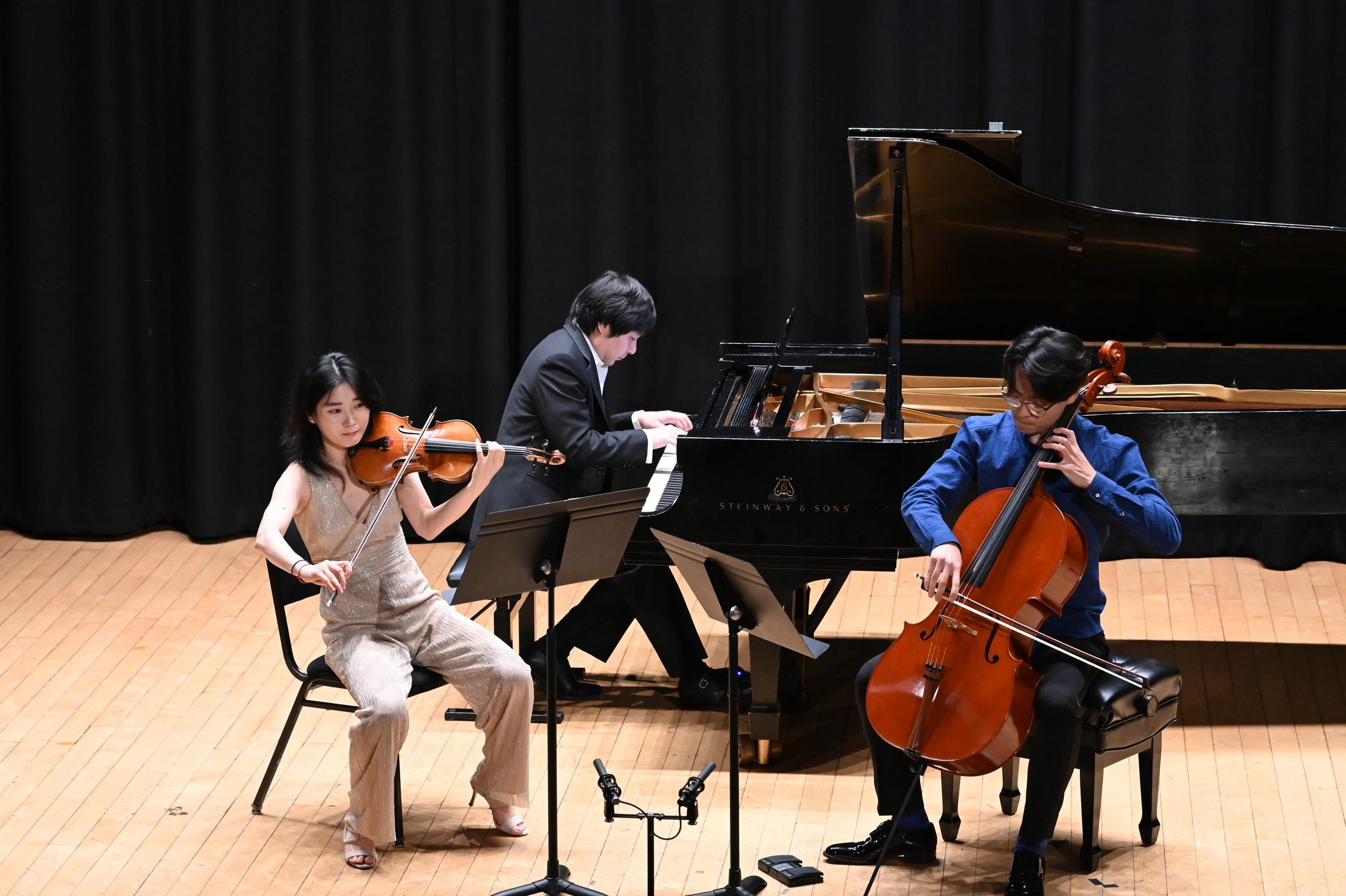 Piano trio performing at an OMI Presents concert